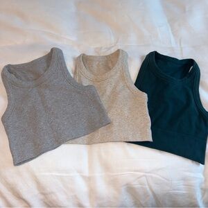 ALO Set of Three Cropped Tank Tops in Gray, Oatmeal Heather, and Teal